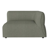 Curved green sofa with a textured fabric and minimalist design, perfect for contemporary interiors.