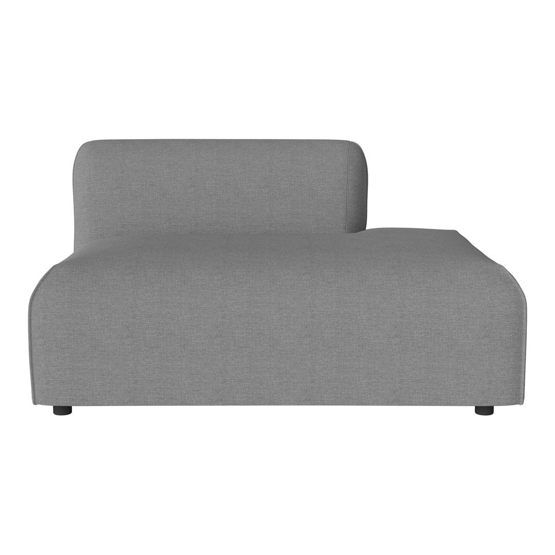 Gray upholstered chaise lounge with a smooth, modern design. Minimalist style complements various decor.