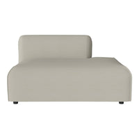 Beige minimalist chaise lounge with smooth, modern lines for a contemporary living space.
