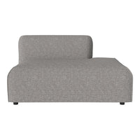 Gray, textured fabric chaise lounge with a minimalist design and soft, curved edges. Perfect for modern decor.