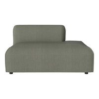 Sleek, modern chaise lounge in a soft gray fabric with a subtle textured pattern. Ideal for contemporary spaces.