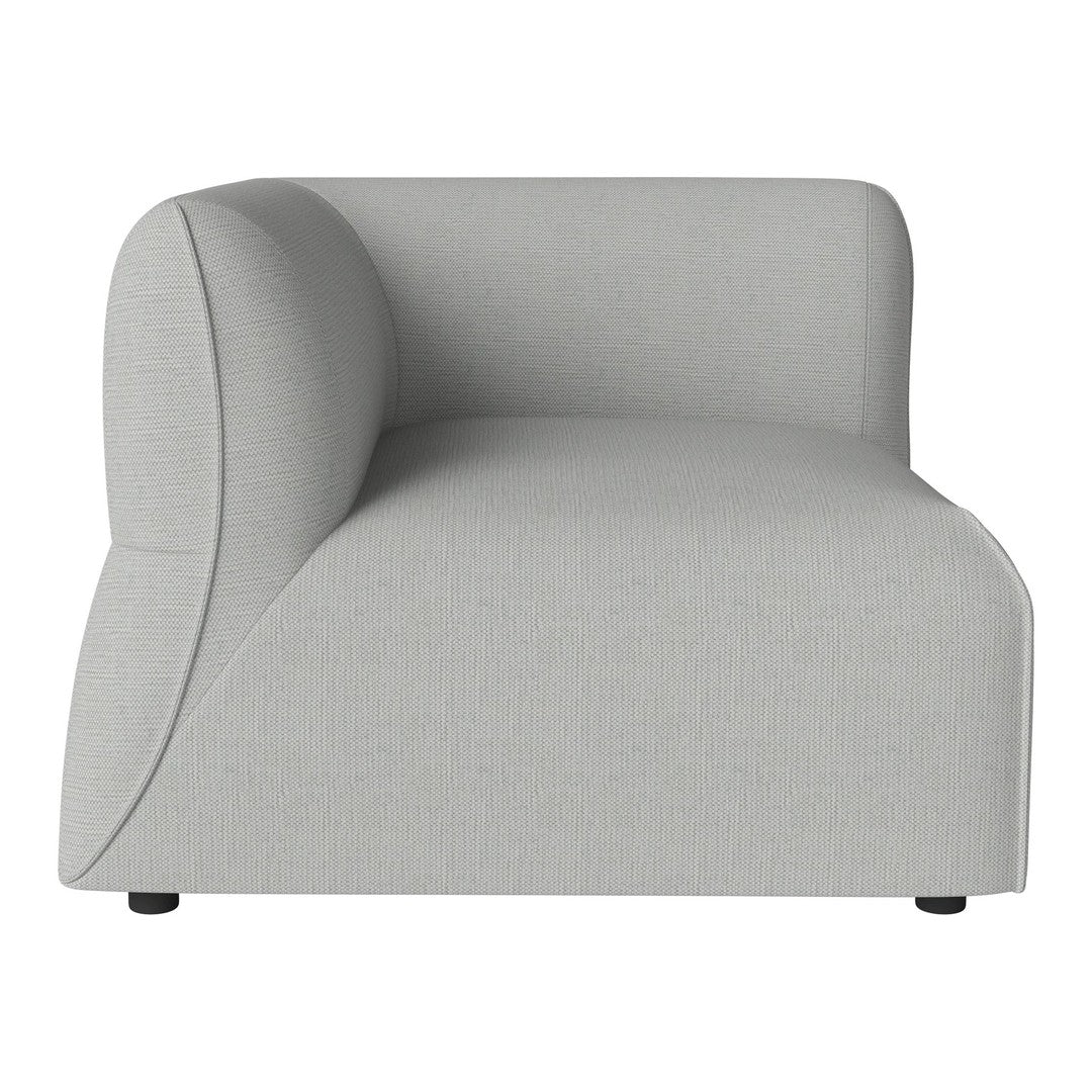 Light gray curved sofa with a smooth texture and minimalist design, perfect for contemporary interiors.