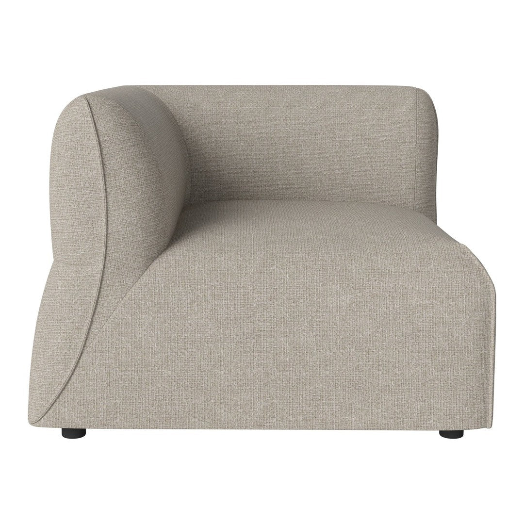 Light beige curved accent chair with a smooth texture and subtle fabric pattern, ideal for modern decor.