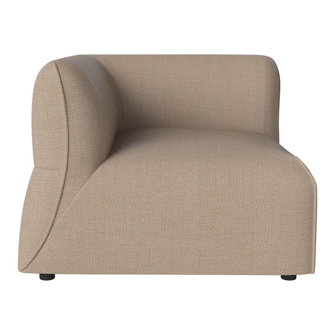 Beige upholstered sofa with a smooth, textured finish and curved silhouette. Ideal for modern decor.