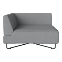 Grey sectional sofa with a minimalist design and textured fabric, featuring a sleek black base. Perfect for modern spaces.