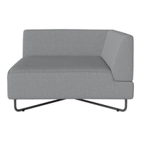 Gray textured fabric corner chair with minimalist design and sleek metal legs. Perfect for modern living spaces.