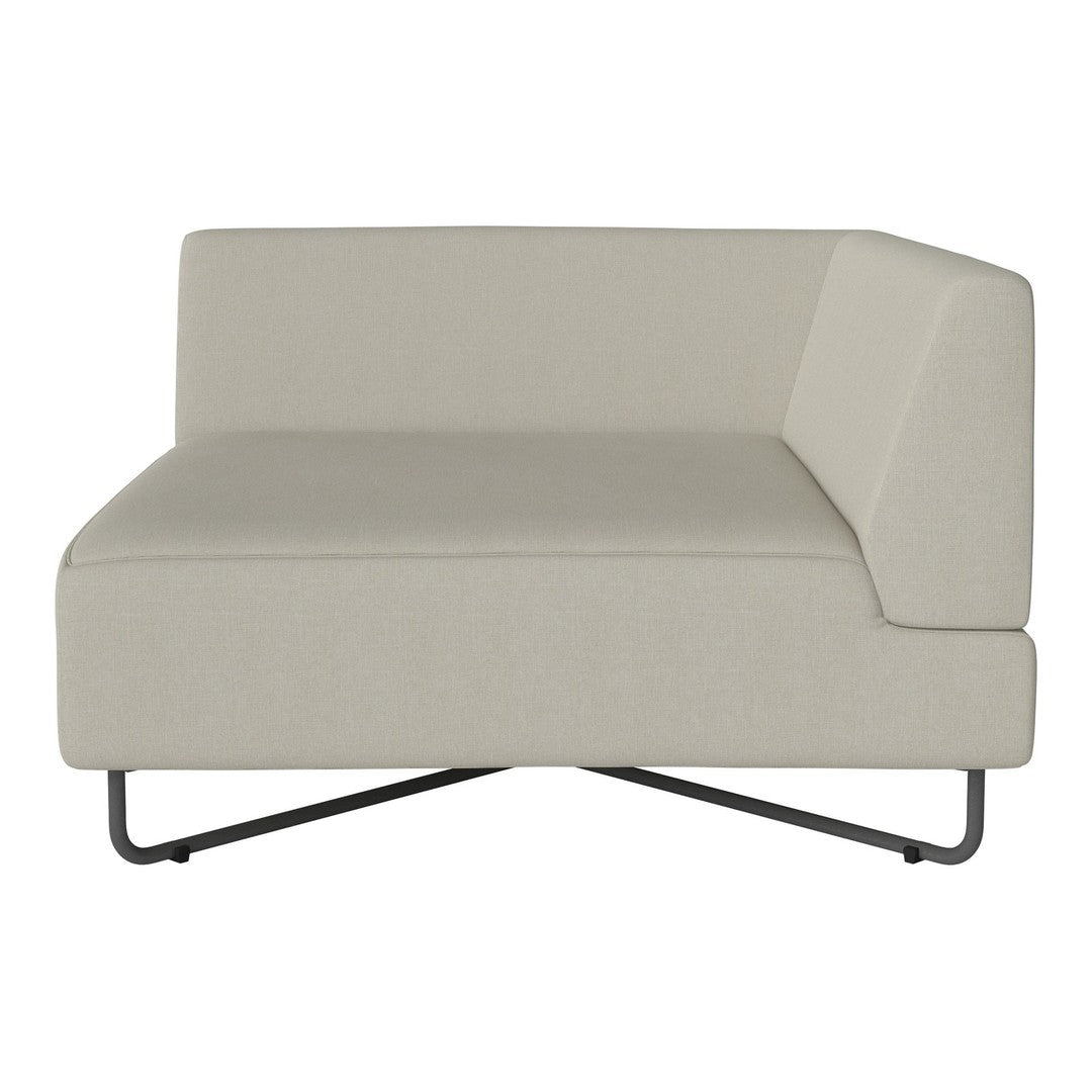 Light beige sofa with a minimalist design and smooth fabric, featuring a slanted armrest and sleek metal legs.