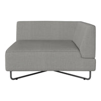 Gray upholstered corner sofa with a minimalist design and clean lines, featuring a textured fabric finish.
