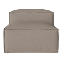 Taupe upholstered chair with a smooth, textured fabric, featuring clean lines and a minimalist design.