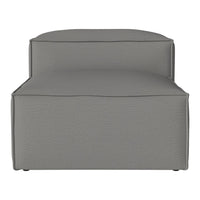 Gray upholstered chaise lounge with a sleek, modern design and subtle textured pattern. Perfect for contemporary spaces.