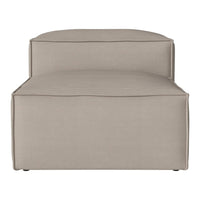 Beige upholstered chaise lounge with a smooth, minimalist design and subtle stitching detail. Perfect for modern decor.