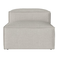 Light gray upholstered chair with a smooth, minimalist design and subtle texture, perfect for modern decor.