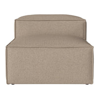 Beige upholstered ottoman with a smooth, textured fabric and minimalist design. Perfect for modern decor.