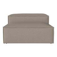 Taupe upholstered lounge chair with a smooth, solid texture and subtle contemporary design. Ideal for modern decor.