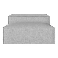 Gray upholstered chaise lounge with a clean, modern design and subtle textured pattern. Perfect for contemporary spaces.