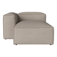Beige upholstered modular sofa with a minimalist design and smooth fabric surface.