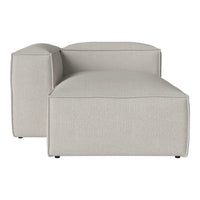 Light gray sectional couch with a smooth, minimalistic design and no visible patterns. Perfect for modern decor.