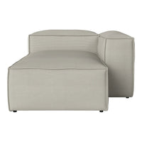 Light gray modular couch with a smooth, minimalist design and subtle texture. Perfect for modern interiors.