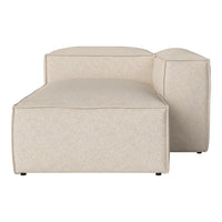 Beige textured chaise lounge with smooth, modern lines and a minimalist design.