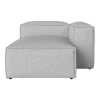 Light gray modular sofa with a smooth, textured fabric and subtle, modern design. Ideal for contemporary spaces.