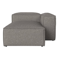 Gray textured fabric chaise lounge with a minimalist design, featuring clean lines and a modern aesthetic.