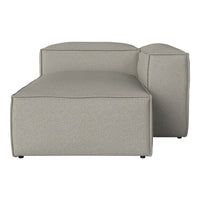 Light gray fabric chaise lounge with simple, modern boxy shape and subtle textured pattern. Perfect for contemporary decor.