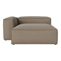 Beige textured chaise lounge with clean, modern lines and subtle woven pattern. Perfect for contemporary interiors.