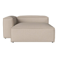 Beige upholstered chaise lounge with a textured pattern, featuring clean lines and minimalistic design.