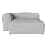 Modern gray upholstered sectional with a minimalist, solid pattern and clean lines. Perfect for contemporary spaces.