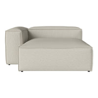 Beige sectional sofa with a textured fabric pattern, offering a modern and minimalist design.