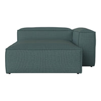 Teal upholstered sectional sofa with a smooth, textured finish, featuring clean lines and minimalist design.