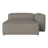 Gray upholstered sectional sofa with a subtle textured pattern, featuring clean lines and a contemporary design.