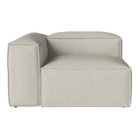 Light beige upholstered sectional sofa with a minimalist design and textured fabric. Perfect for modern interiors.
