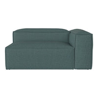 Teal upholstered sectional sofa with a sleek, modern design and textured fabric pattern. Perfect for contemporary spaces.