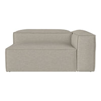 Grey modular sofa with a minimalist design and soft, textured fabric in neutral tones. Perfect for contemporary decor.