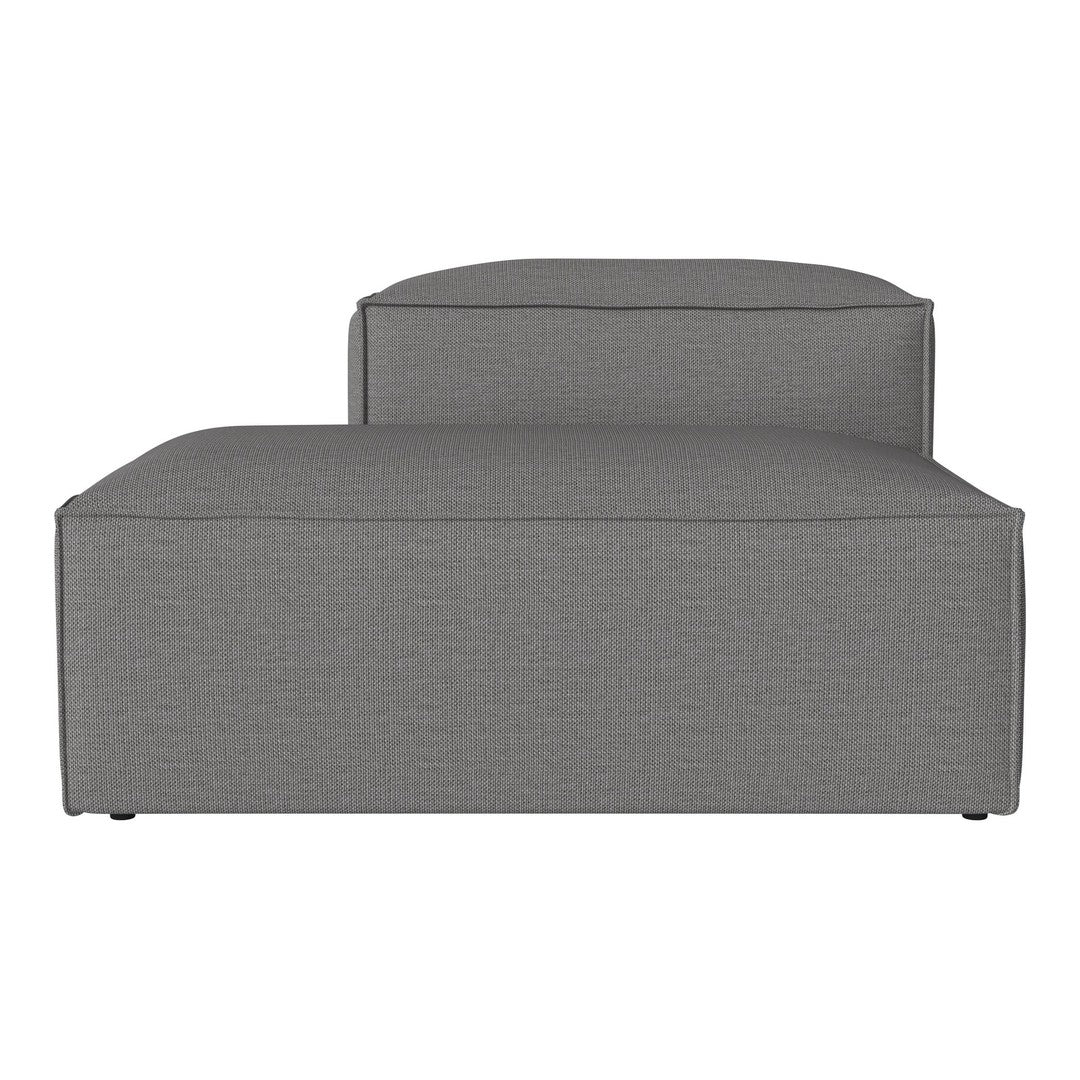 Gray upholstered chaise lounge with textured fabric and minimalist design. Perfect for modern decor.