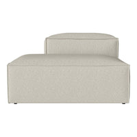 Light beige fabric chaise lounge with a subtle textured pattern, featuring a contemporary design and clean lines.