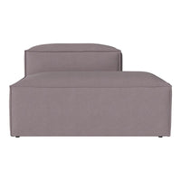 Gray upholstered chaise lounge with a smooth, minimalist design and soft, modern lines. Perfect for contemporary decor.