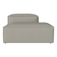 Beige upholstered chaise lounge with a smooth texture and minimalist design. Perfect for modern interiors.