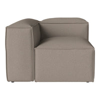 Beige upholstered sectional couch with a smooth, textured fabric and clean, modern lines. Perfect for minimalist decor.