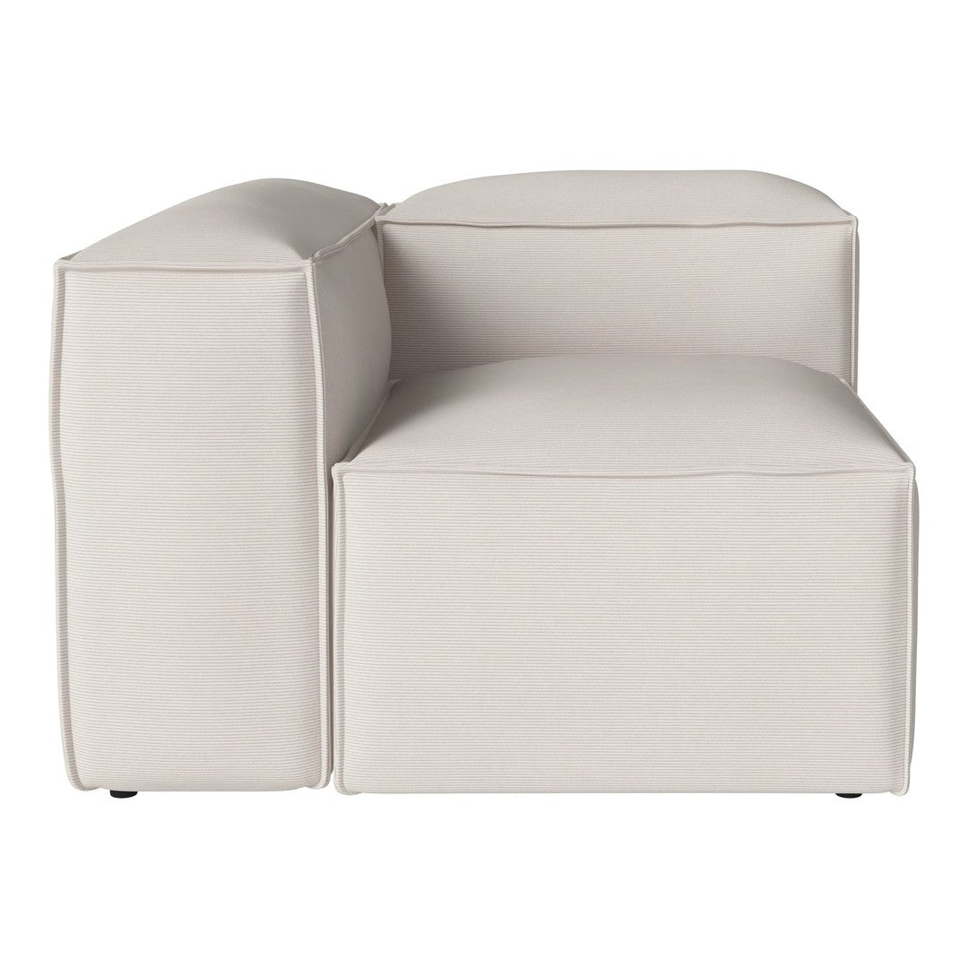 Beige modular sofa corner piece with smooth, minimalist design and subtle stitching detail.