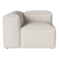 Beige modular sofa corner piece with smooth, minimalist design and subtle stitching detail.