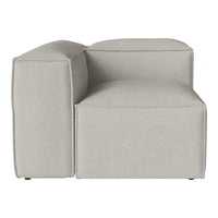 Light gray sectional sofa with a smooth, minimalist texture and no patterns, ideal for modern decor.