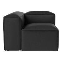 Black modular armchair with a sleek, modern design and boxy structure, perfect for contemporary living spaces.