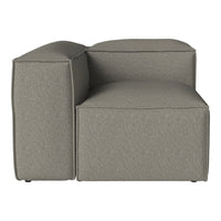 Gray textured upholstered corner chair with minimalist design and clean lines. Perfect for modern decor.