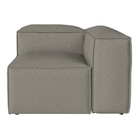 Gray upholstered modern sectional sofa with a sleek, minimalist design and subtle textured fabric.