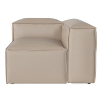Beige modular sofa with a minimalist design, featuring smooth, clean lines and a contemporary, neutral aesthetic.
