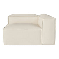 Cream-colored modular sofa with a minimalist design and smooth, textured fabric. Ideal for modern living spaces.