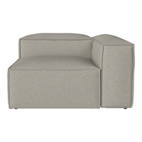 Light gray sectional sofa with a smooth, textured fabric and modern geometric design. Perfect for contemporary decor.