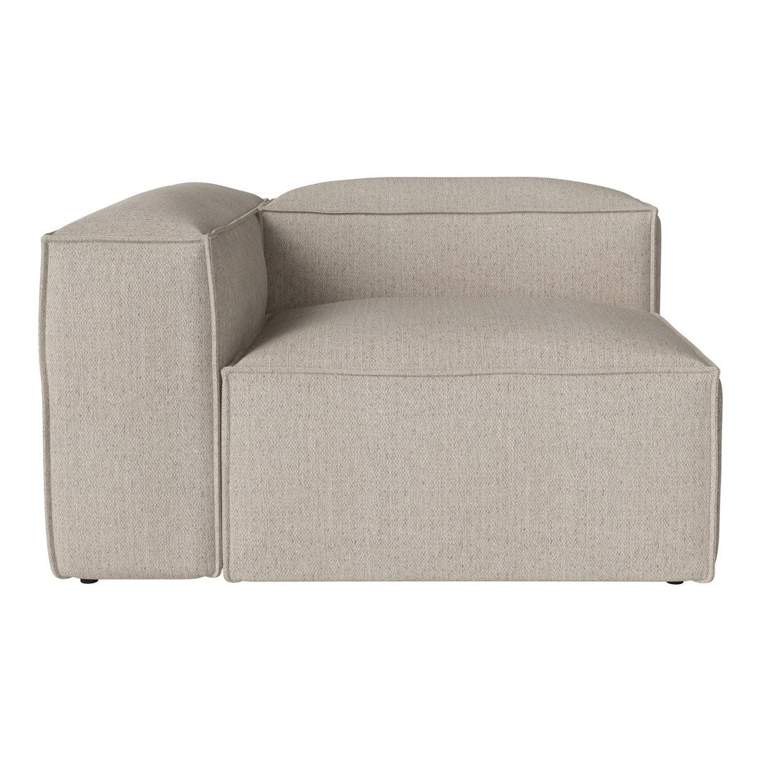 Beige upholstered sectional couch with a smooth, textured fabric and minimalist design.